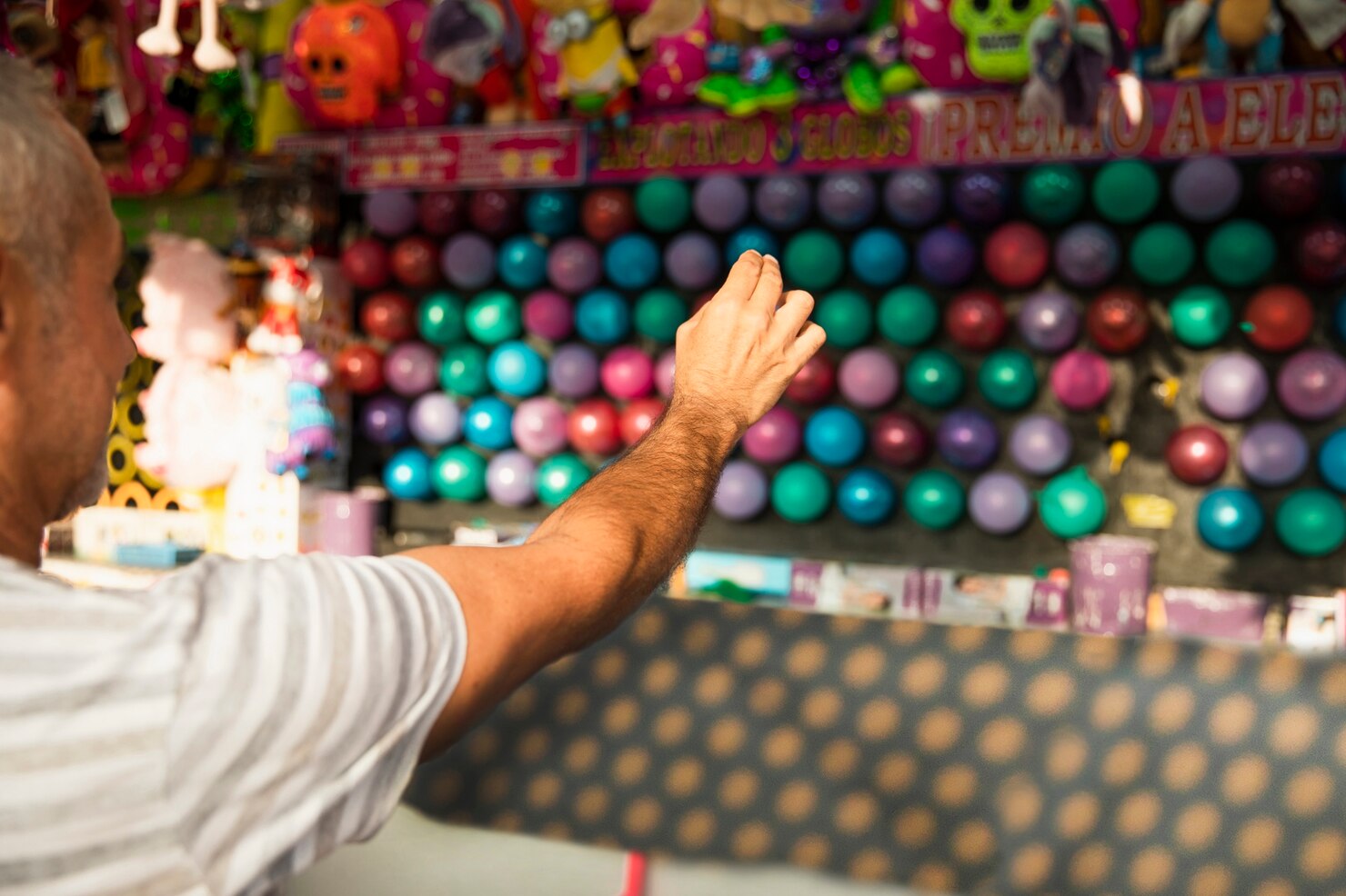 Close Up Man Popping Balloons 23 2148287895